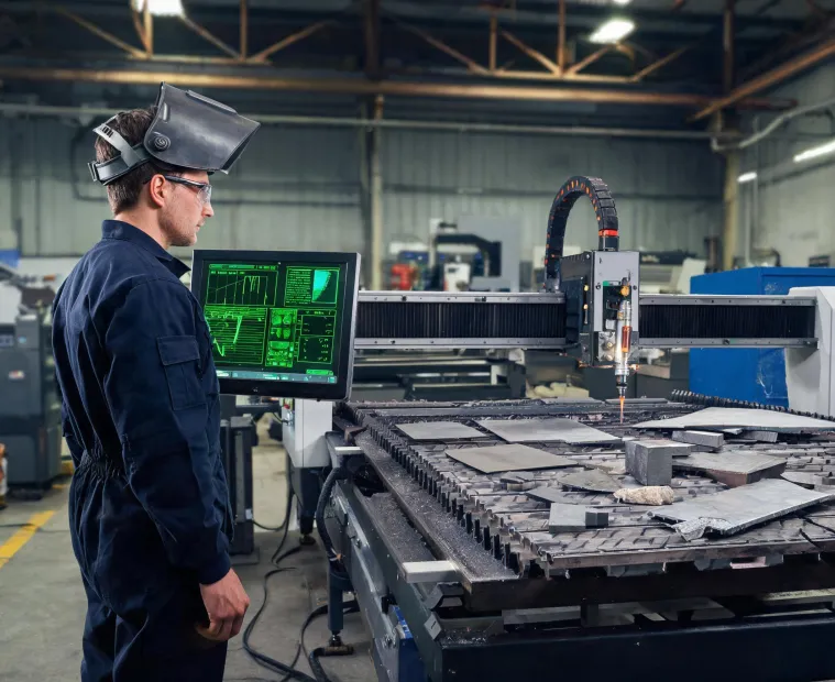 Engineer reviewing plasma cutter control data